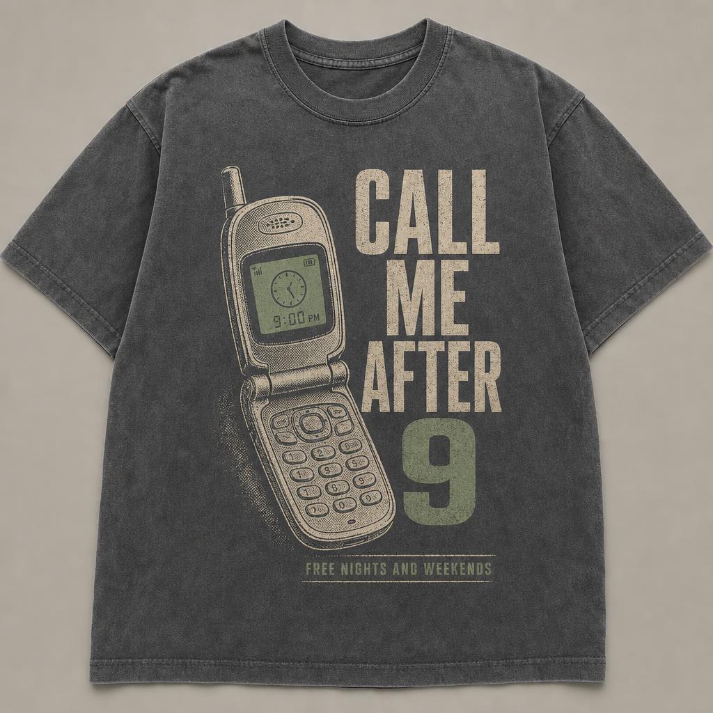 Washed charcoal t-shirt printed with an open early-2000s flip phone showing 9:00 PM