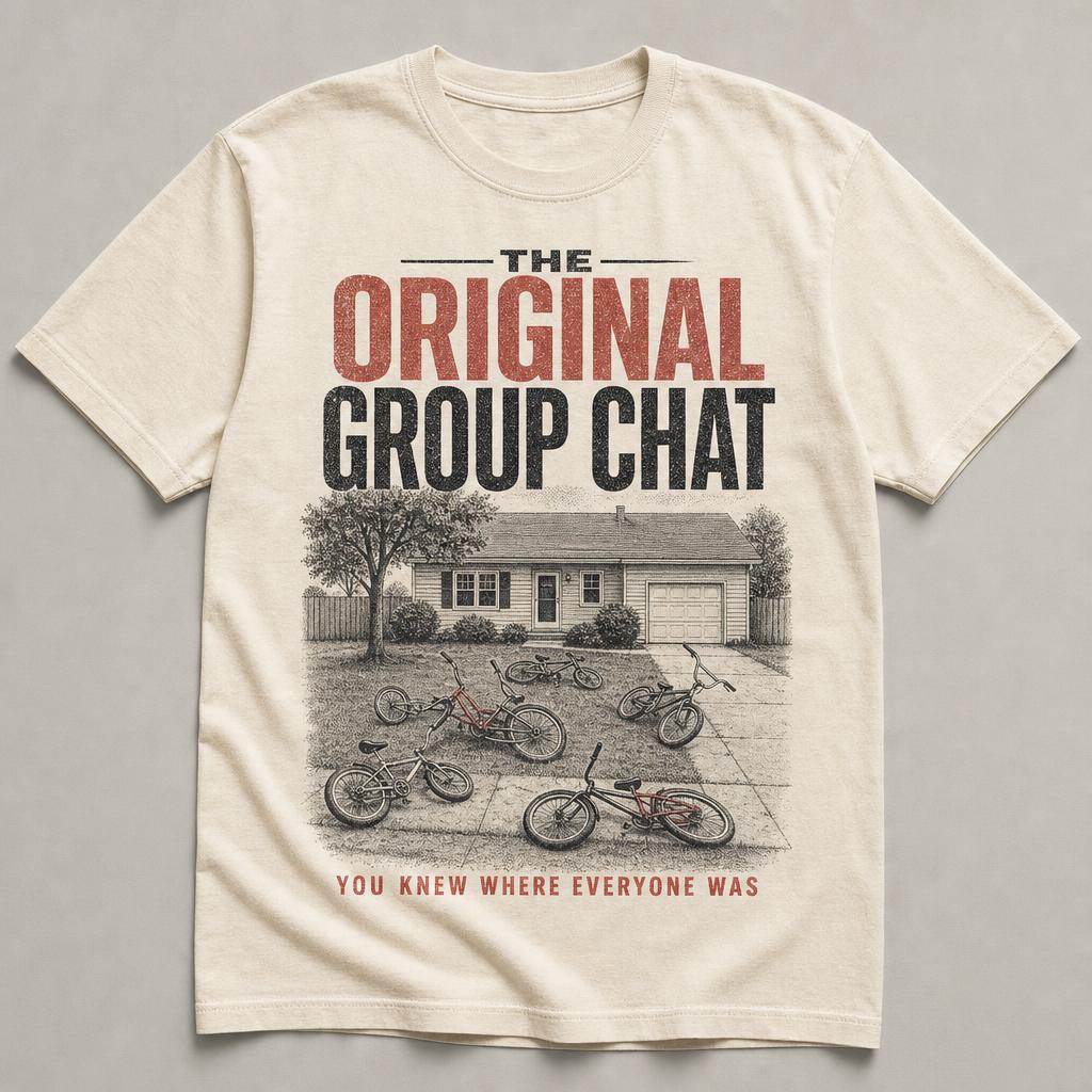 Cream t-shirt printed with several kids' bikes dropped on the lawn of a plain suburban house